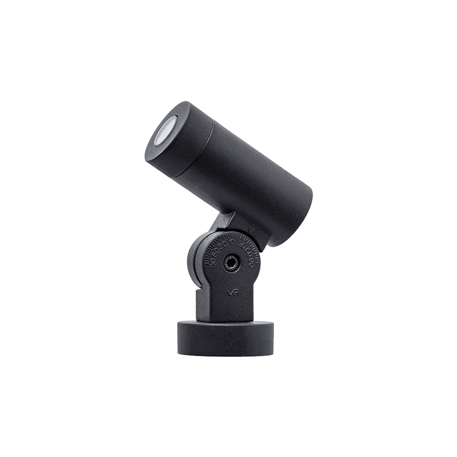 Black adjustable outdoor spotlight on a ground spike, angled upward.